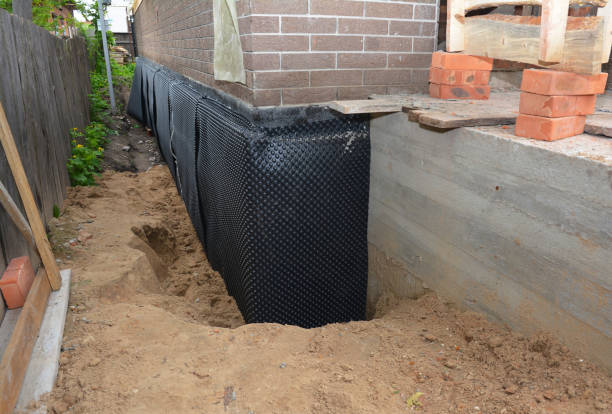 Happy homeowners after waterproofing job in Jamestown